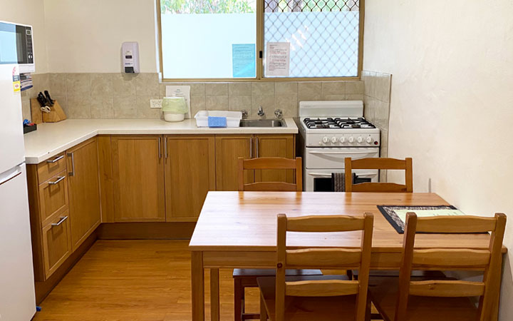 Fully equipped kitchen with refrigerator, stove, oven, cooking utensils and microwave for self catering 